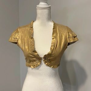 Cropped gold cap sleeve leather jacket